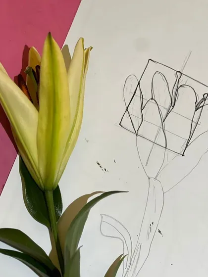 Every great painting starts with an idea. Here, we're brainstorming and sketching concepts for our Georgia O'Keeffe-inspired floral paintings, studying the shapes and lines of a real lily.