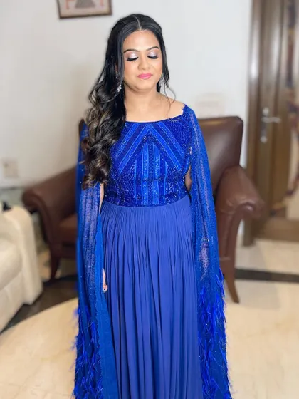 A beautiful look for a client in a stunning royal blue gown. I created a soft, shimmery eye and a bright pink lip to complement the outfit.