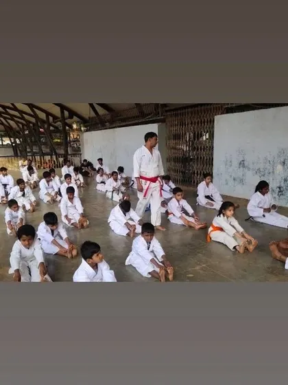 The beginning of a belt exam at our Malleshwaram dojo. Students are led through stretching and warm-up exercises to prepare their bodies and minds for the test ahead.