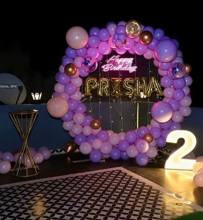 A purple and pink version of the ring decoration, showing our flexibility with color palettes to match your preference.
