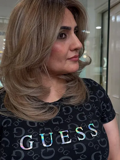 A fresh blonde transformation. We aimed for bright tones and a flawless finish, and this layered cut with a soft wave perfectly showcases the new color.