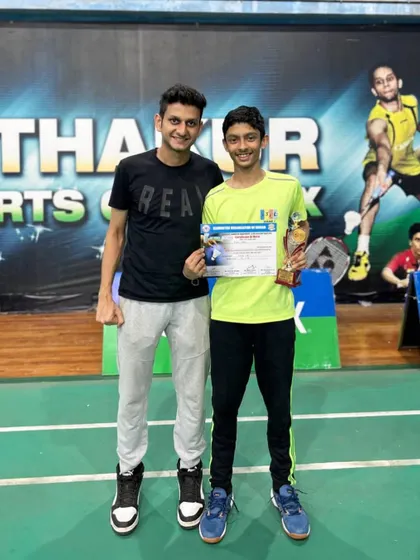 Pravit Sahu with his coach after winning the runners-up trophy at the Raigad district selection championship. His performance earned him a spot at the next level of competition.