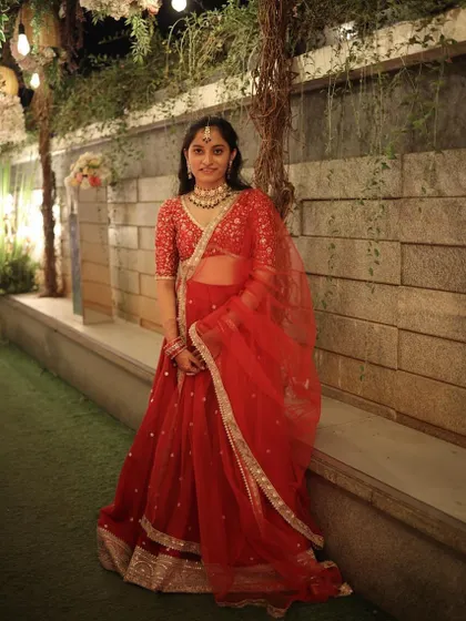 This client rented a stunning red lehenga for her sister's wedding and looked absolutely gorgeous. I styled her head to toe, including the traditional jewelry.