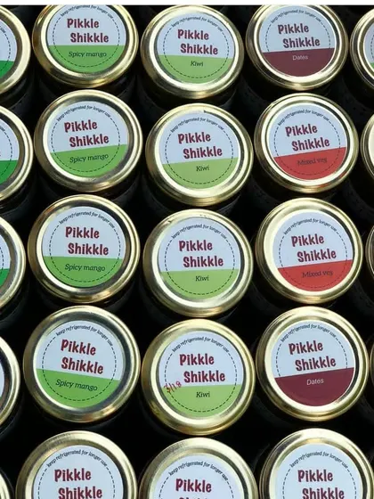 An overhead shot of our colourful pickle lids, showing the variety we offer.