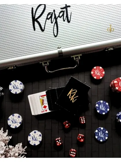 This personalized poker set is the ultimate gift for game night lovers. The sleek silver case is customized with a name, and the chips and cards inside can also be personalized with initials for a truly unique set.