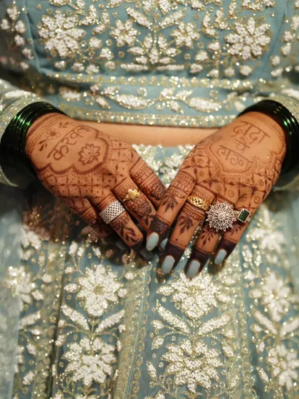 The final stain tells the real story. This is the rich, dark color my client got for her brother's wedding, achieved with my all-natural henna paste. The design includes 'Dada' and 'Vahini' to celebrate the new couple.