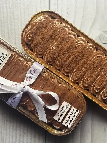 My Tiramisu Tres Leches Boats are a fusion of two classic desserts. They are creamy, indulgent, and come in this elegant boat-shaped tin, perfect for gifting or enjoying yourself.