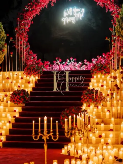 This is what turning a dream into reality looks like. For this grand proposal in Karjat, I used hundreds of candles and a cascade of red roses to create a dramatic, unforgettable pathway. The glowing "Will You Marry Me?" sign at the top of the stairs adds that final, magical touch for a truly cinematic moment.