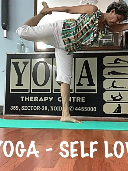 A variation of Dancer's Pose, showing the balance and flexibility required. It's a joyful and heart-opening posture.