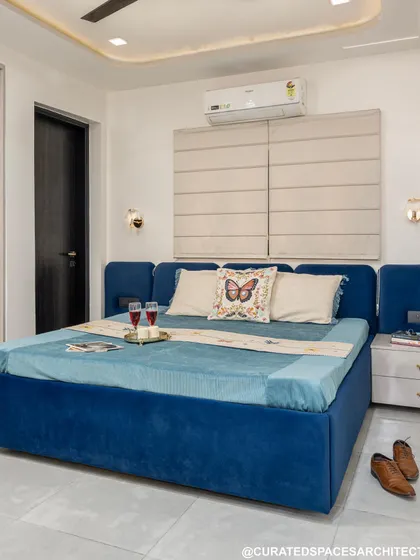 I love how this fresh and elegant royal blue bedroom turned out. The plush, upholstered bed frame adds a touch of luxury, while the neutral walls and flooring keep the space feeling bright and airy.
