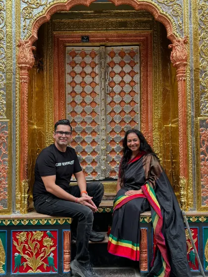 A moment of storytelling captured. Our founder Sachin Bansal with historian Dr. Farhat Nasreen, sharing tales of history by a golden door in Old Delhi.