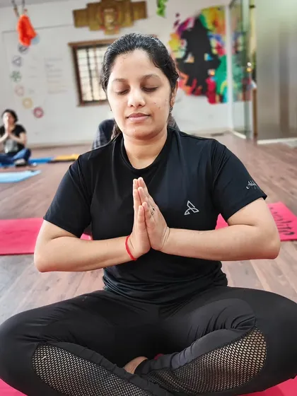 A moment of quiet contemplation in a seated prayer pose.