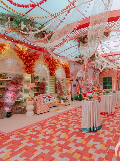 An immersive 'La Dolce Vita' themed engagement party, showcasing a vibrant color palette, custom flooring, and distinct seating areas that transport guests to a sun-kissed Italian piazza.