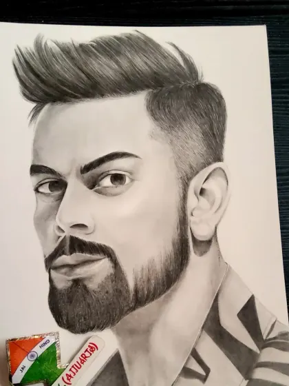 This photo shows my Virat Kohli sketch alongside the pencil I used. It gives a sense of scale and the tools behind the art.