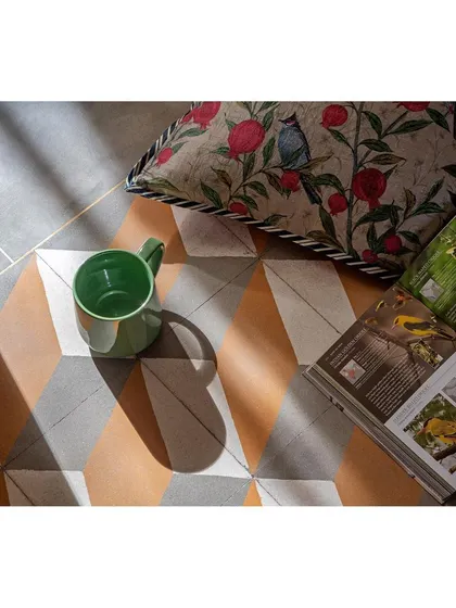 A detail of the flooring in Nataraj House, where polished cement, contemporary cement tiles, and brass inlays are juxtaposed to create a luxurious yet earthy feel.