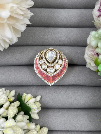 Our leaf-shaped adjustable rings, featuring a large central Moissanite stone surrounded by American Diamonds. These are available in green, red, and pink Meenakari finishes.