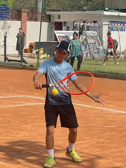 A young player learning how to balance the ball on his racket. This simple drill is great for developing hand-eye coordination and racket feel.