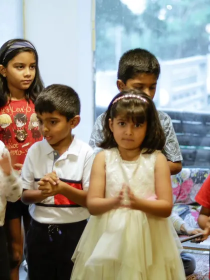 The summer camp kids clapping along during their recital. The sense of community and support is amazing.