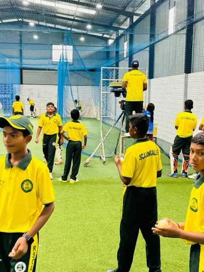 The bustling atmosphere of our indoor training center, where players of different age groups work on their game side-by-side.