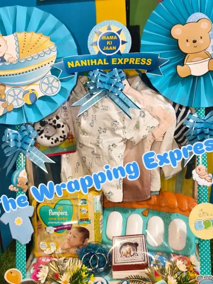 A beautiful 'Nanihal Express' hamper with a 'Mama ki Jaan' sign. It's packed with diapers, clothes, and toys, making it a very thoughtful and complete gift from the maternal family.