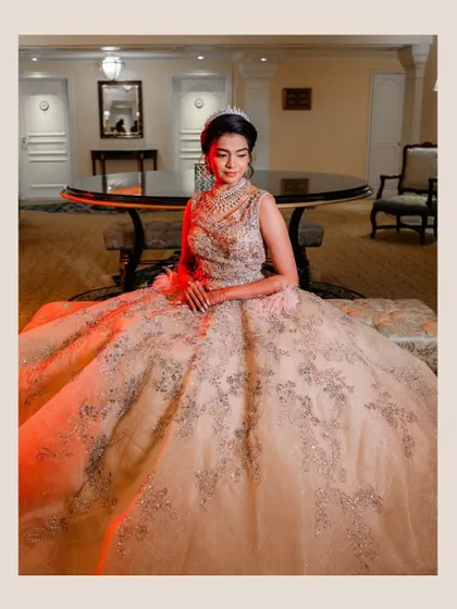 A solo portrait of Aishwarya, showcasing her stunning bridal gown and tiara. The makeup is soft yet defined, enhancing her natural beauty for a truly regal bridal look.