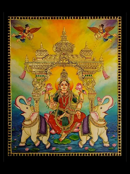 A detailed, un-framed view of our Goddess Lakshmi Tanjore painting. This highlights the intricate gold work and the rich, layered colors that define this sacred art form, showcasing the craftsmanship before it's framed.