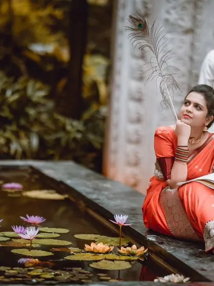 A more saturated version of the lily pond portrait, making the colors of the saree and the flowers pop for a vibrant, artistic look.