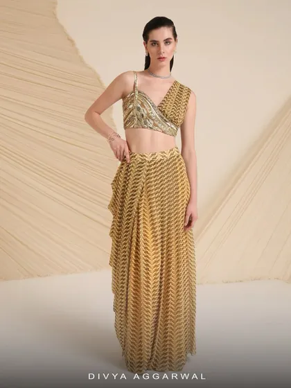 Our Verity co-ord set features a printed and hand-embroidered asymmetrical blouse with a drape-style skirt that’s made for twirling.
