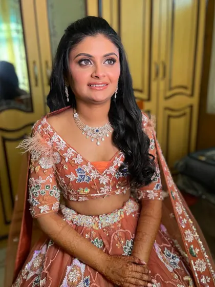The client looks radiant and ready to celebrate in her glamorous Sangeet makeup.