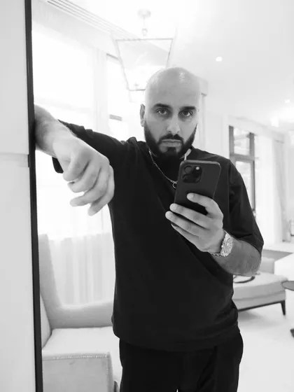 A mirror selfie, but make it art. Capturing the moment in black and white adds a timeless feel.