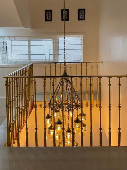 This intricate chandelier at the Jolly Residence hangs in a double-height space above the staircase. This image highlights our focus on sourcing unique lighting fixtures that act as functional art.