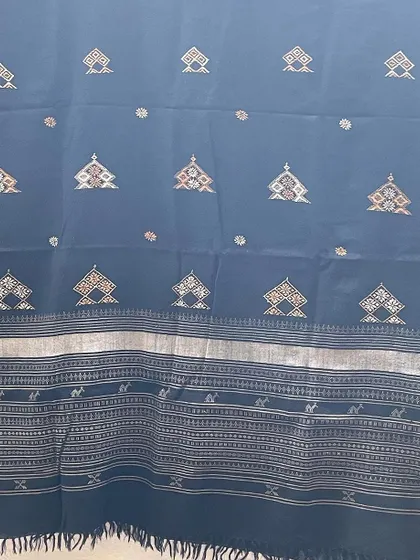 Another example of a hand-embroidered woollen shawl, perfect for the winter season. The intricate patterns are stitched with care by my artisans.
