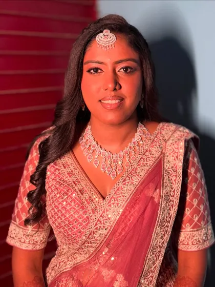 Vaani looking absolutely divine for her reception. The complete look features soft, flowing hair and makeup that enhances her natural glow.