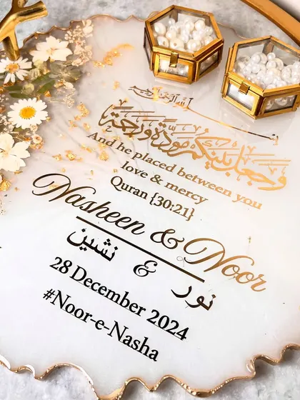 A detailed shot of the personalization, including the couple's names, wedding date, and hashtag.