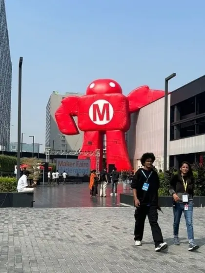 The entrance to T Works is designed as an open and welcoming plaza. During events like the Maker Faire, it becomes a bustling public space, proving that the area outside a building is just as important as the space within.