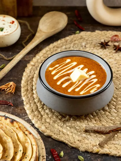 This shot captures the heart of North Indian cuisine. I used dark, moody lighting to emphasize the rich texture of the curry and the creamy swirl, making this classic dish feel both comforting and luxurious for a restaurant's menu.