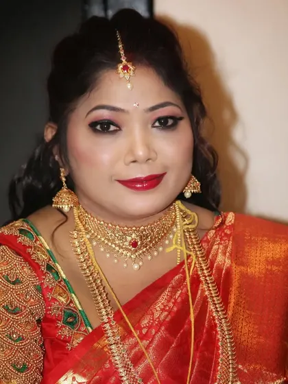 Two different expressions from the same client, Sowmya, showing how the makeup looks beautiful both when she is smiling and when she is posing.