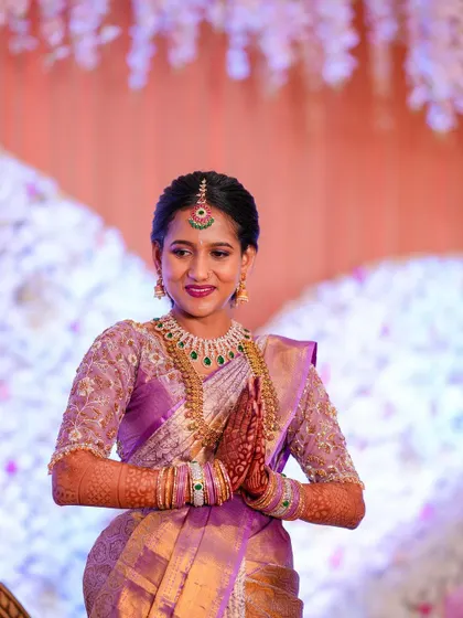 Jagruthi looking elegant and graceful for her Varpooje ceremony. The lavender saree and diamond jewelry create a soft and regal look.