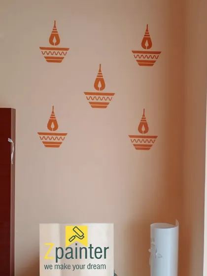 The same diya stencil pattern, showing its clean application on a light-colored wall.