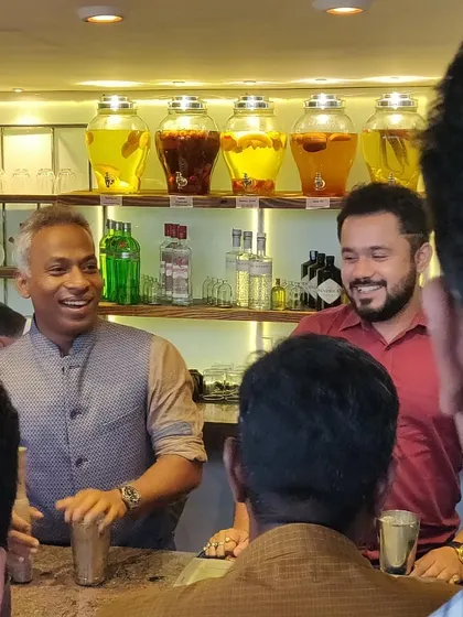 The energy during a group session is always fantastic. Here, I'm sharing a laugh with participants as we get ready to shake up some new creations.
