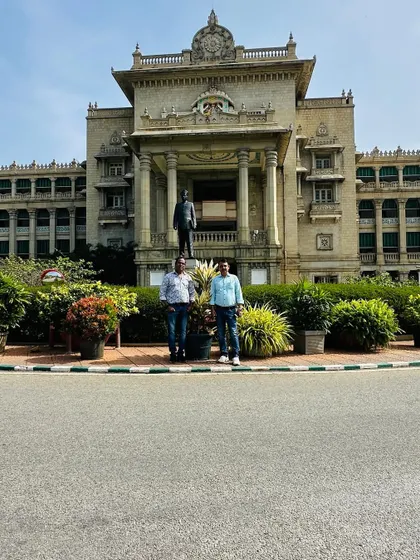 Standing proudly in front of the completed landscaping work at one of Bangalore's most iconic buildings. It is a privilege to contribute to the beauty of our public spaces.