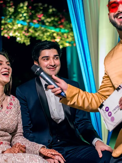 Capturing the laughter and fun of Sangeet games. These candid moments show the genuine joy shared by the couple and their guests.