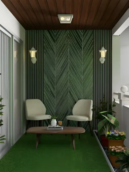 A serene balcony with a dark green accent wall featuring a chevron pattern. Two comfortable chairs and a coffee table make it the perfect spot for a quiet morning coffee.