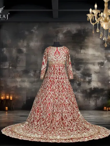 A full view of the red net double tail Indo-Western bridal outfit, showcasing its dramatic silhouette and intricate detailing, perfect for a grand entrance.