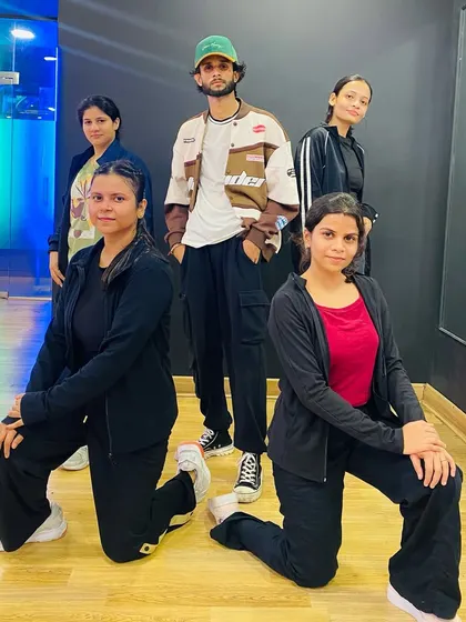A smaller group from our Bollywood class posing for a picture. Every class is a chance to learn and grow together.
