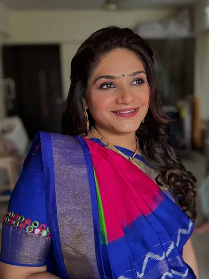 A happy, candid moment. The makeup looks fresh and beautiful in natural light.