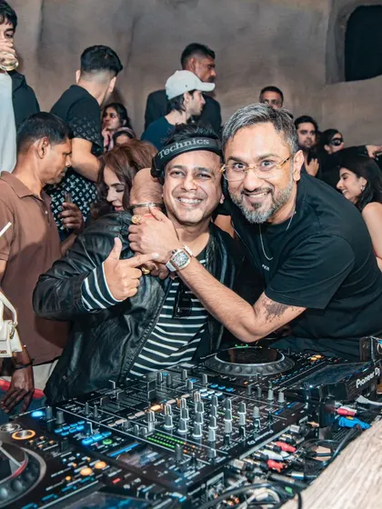 A hug from the legend himself. This picture captures a moment of mutual respect and shared passion for music.