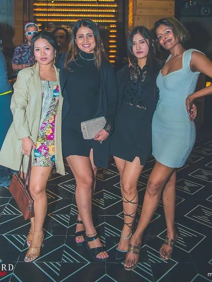 A group of stylishly dressed ladies at the Christmas event.