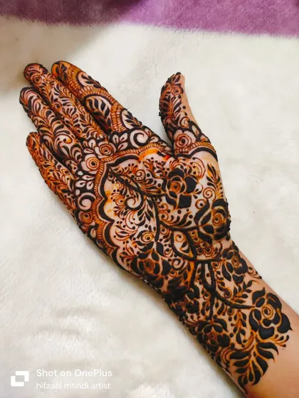A close-up of the palm in this detailed design, showing the fine lines and beautiful motifs.