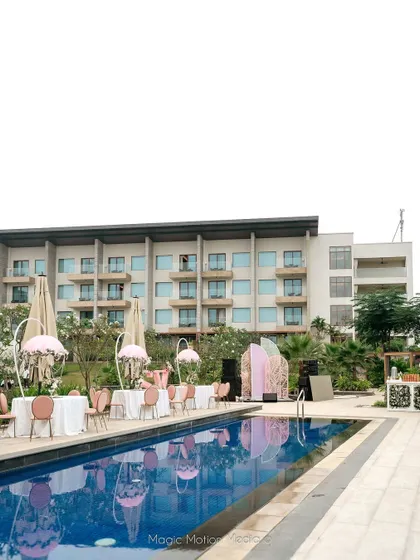 A wide view of the Bridgerton-themed poolside party.